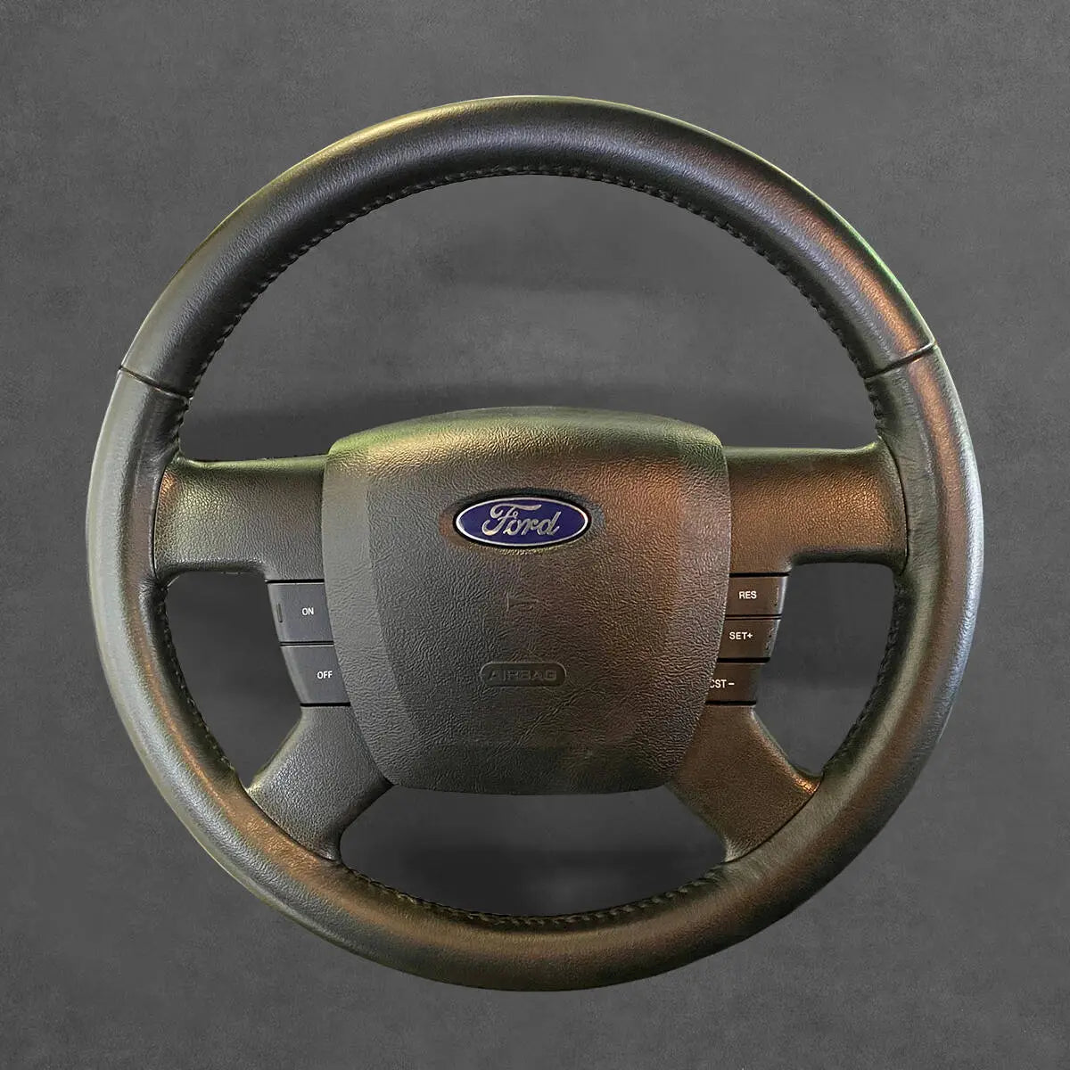 Griffowl Steering Wheel Cover for DIY Pickup Ford Ranger 2004-2011. DIY kit includes hand-sewn wrap for luxury interior mods.