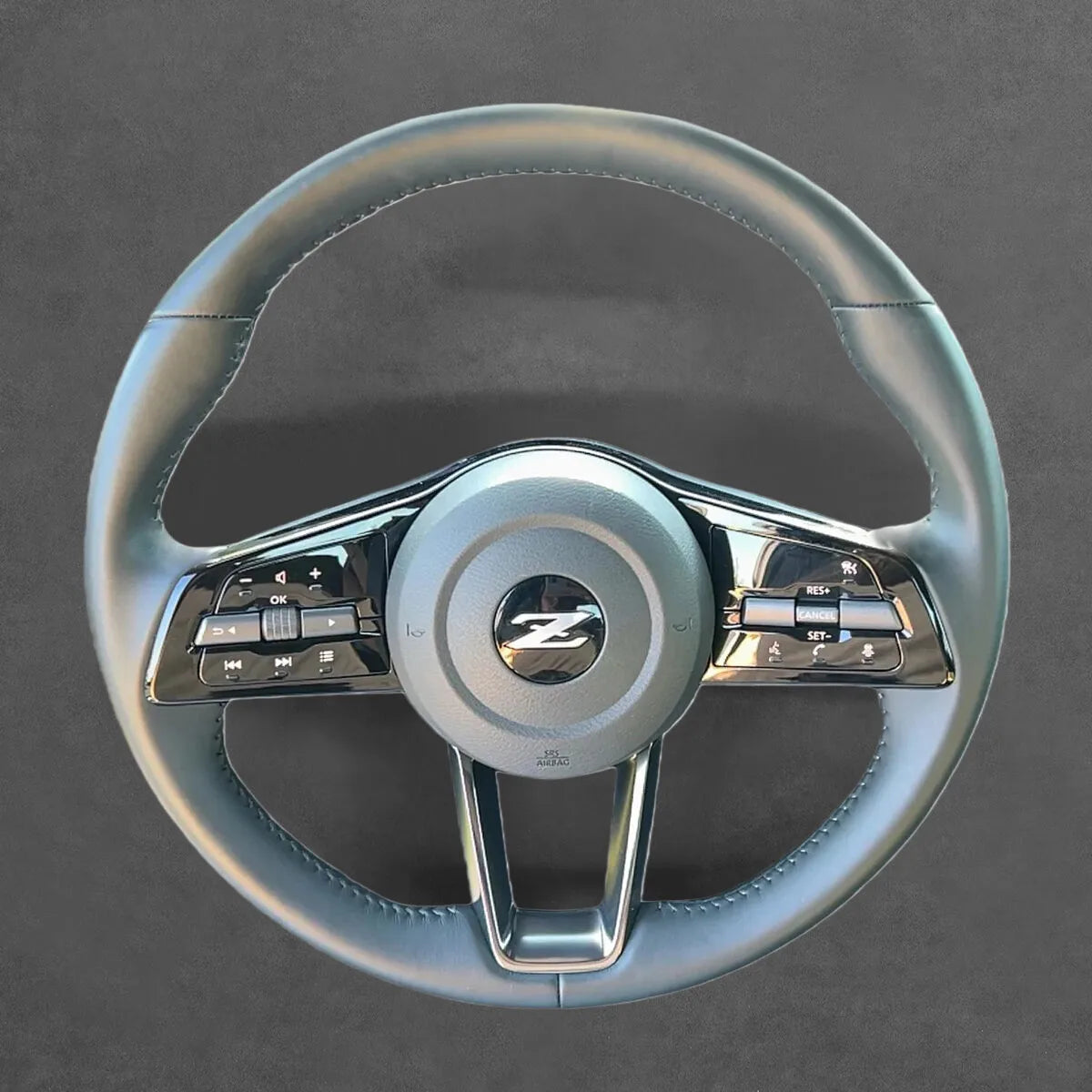 Griffowl Steering Wheel Cover for Tailored Coupe Nissan Z 2021-2024. DIY kit includes hand-sewn wrap for luxury interior mods.