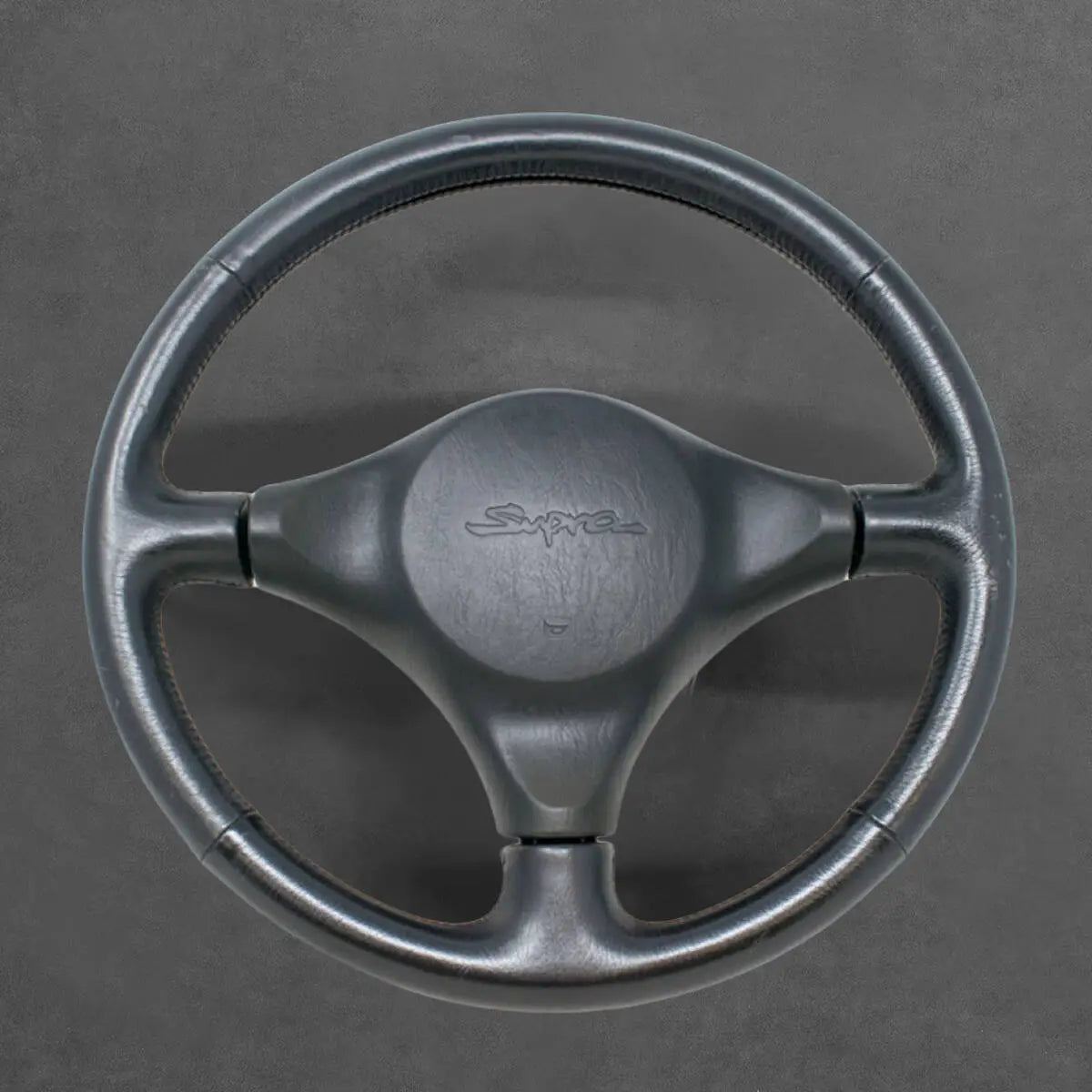 Griffowl Steering Wheel Cover for Tailored Coupe Toyota GR Supra 1993-1995. Perfect grip with our steering wheel wrap and custom interior touch.