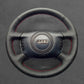 Griffowl Steering Wheel Cover for Bespoke Hatchback Audi A2 2000-2005. Compact, hand-sewn DIY wrap for quick interior mods and grip upgrade.