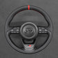Griffowl Steering Wheel Cover for Bespoke Hatchback Toyota Aygo X Yaris IV XP210 Cross 2022-2025. Perfect grip with our steering wheel wrap and custom interior touch.