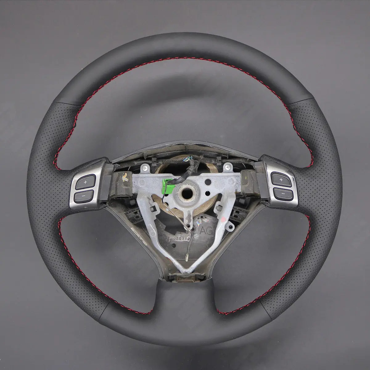 Griffowl Steering Wheel Cover for Crafted Touring Subaru Outback Mutifunction button 2005-2007. Elevate your interior with Griffowl's wrap and stitch kit.
