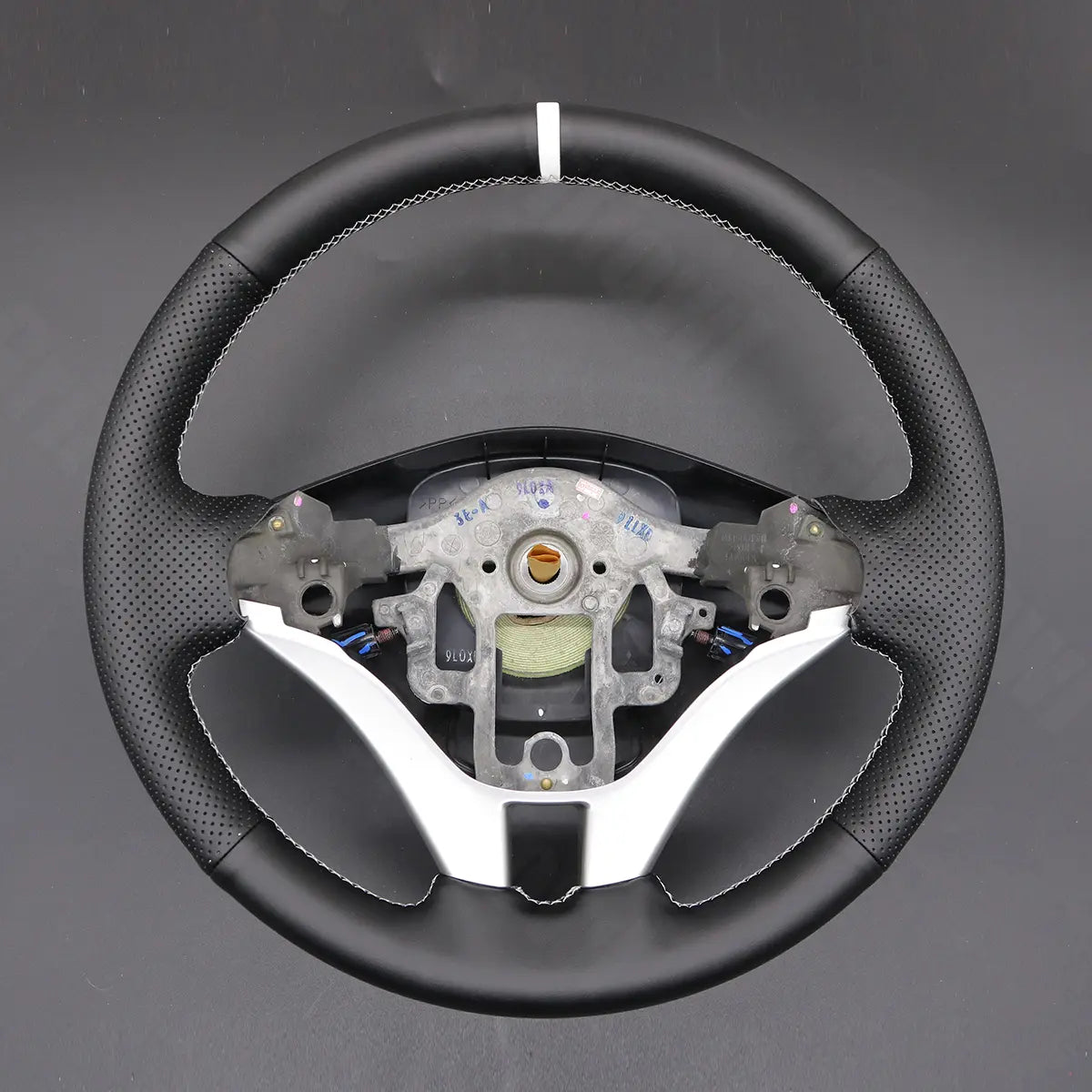 Griffowl Steering Wheel Cover for DIY Pickup Mitsubishi L200 Triton 2006-2015. Griffowl's interior mod with hand-sewn DIY steering wheel kit.
