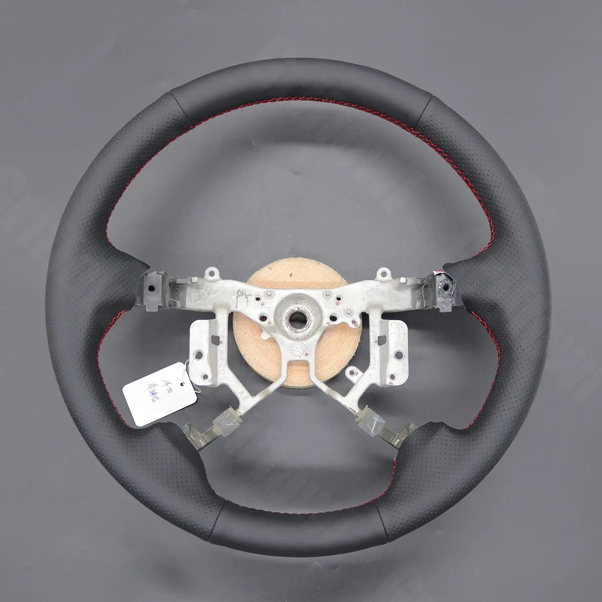 Griffowl Steering Wheel Cover for DIY Pickup Toyota Hilux 2005-2014. DIY kit includes hand-sewn wrap for luxury interior mods.