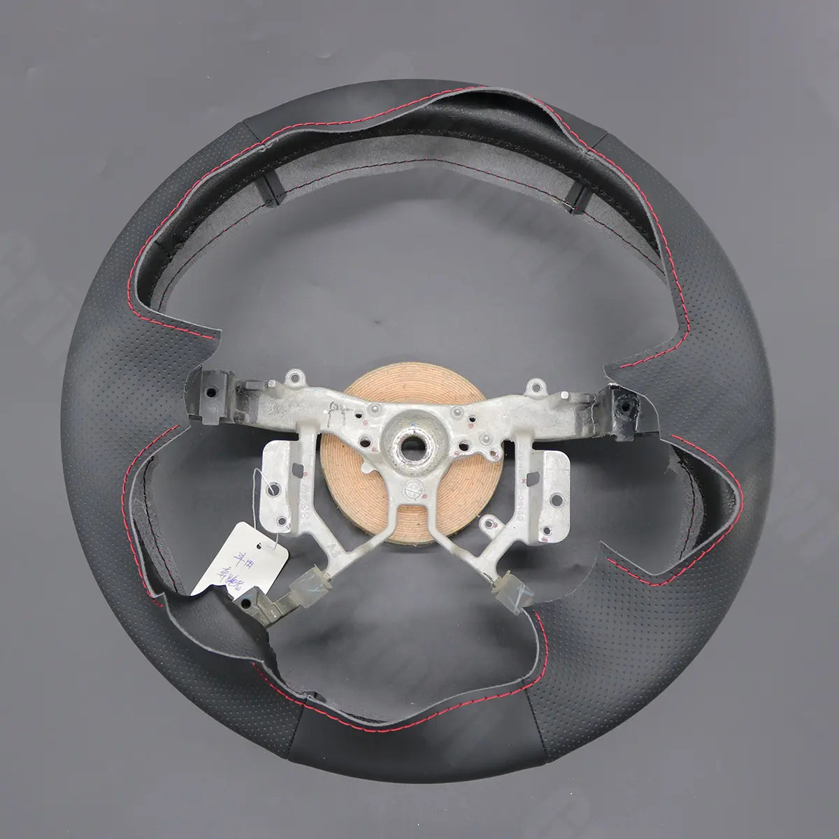 Griffowl Steering Wheel Cover for DIY Pickup Toyota Hilux 2005-2014. DIY kit includes hand-sewn wrap for luxury interior mods.