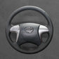 Griffowl Steering Wheel Cover for DIY Pickup Toyota Hilux 2005-2014. DIY kit includes hand-sewn wrap for luxury interior mods.