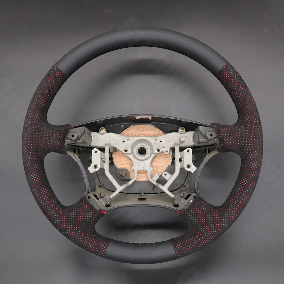 Griffowl Steering Wheel Cover for DIY Pickup Toyota Tundra 2003-2006. DIY kit includes hand-sewn wrap for luxury interior mods.
