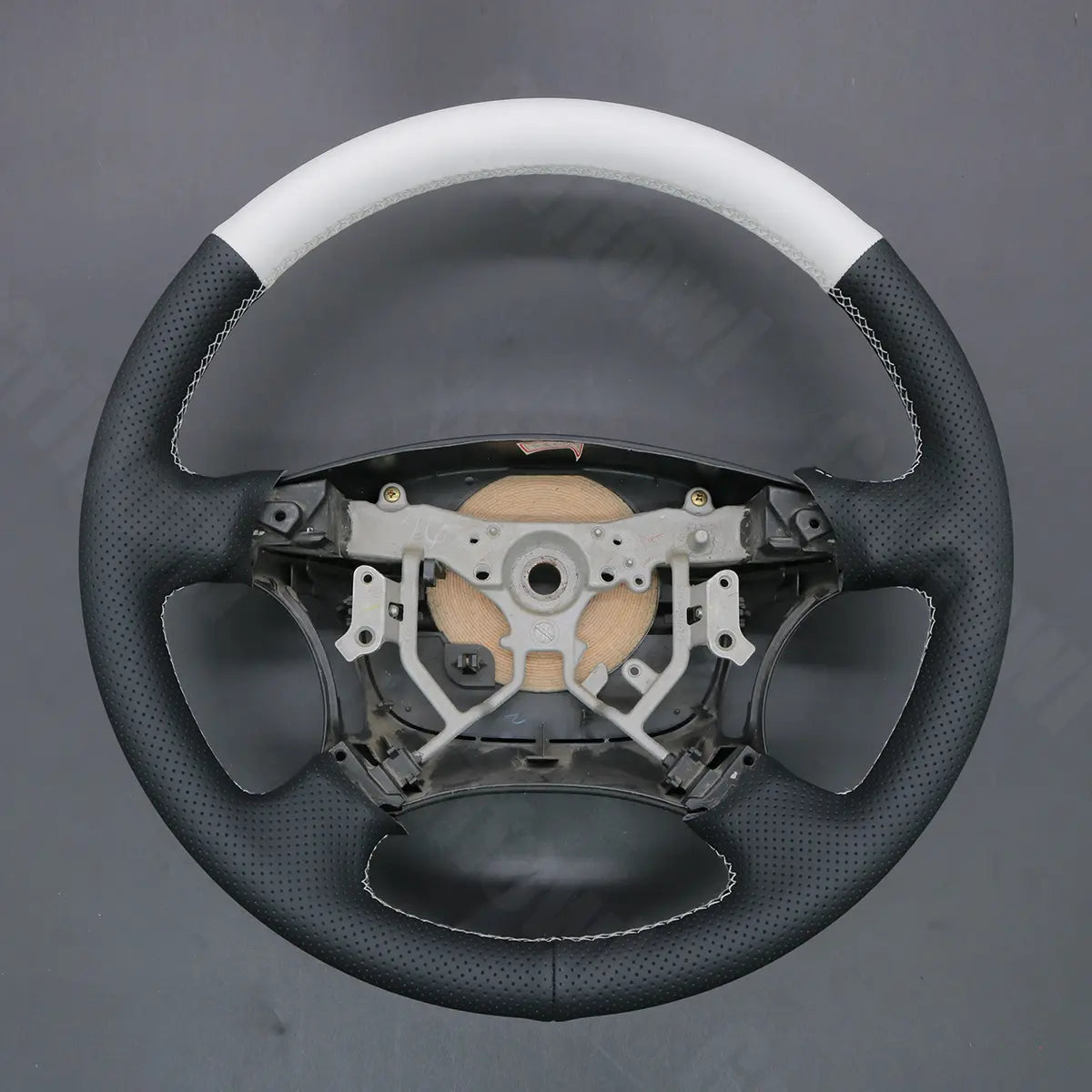 Griffowl Steering Wheel Cover for DIY Pickup Toyota Tundra 2003-2006. DIY kit includes hand-sewn wrap for luxury interior mods.