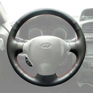 Griffowl Steering Wheel Cover for Personalized SUV Hyundai Santa Fe 2001-2006. Griffowl's interior mod with hand-sewn DIY steering wheel kit.
