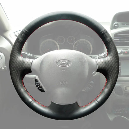 Griffowl Steering Wheel Cover for Personalized SUV Hyundai Santa Fe 2001-2006. Griffowl's interior mod with hand-sewn DIY steering wheel kit.
