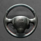 Griffowl Steering Wheel Cover for Personalized SUV Hyundai Santa Fe 2001-2006. Griffowl's interior mod with hand-sewn DIY steering wheel kit.
